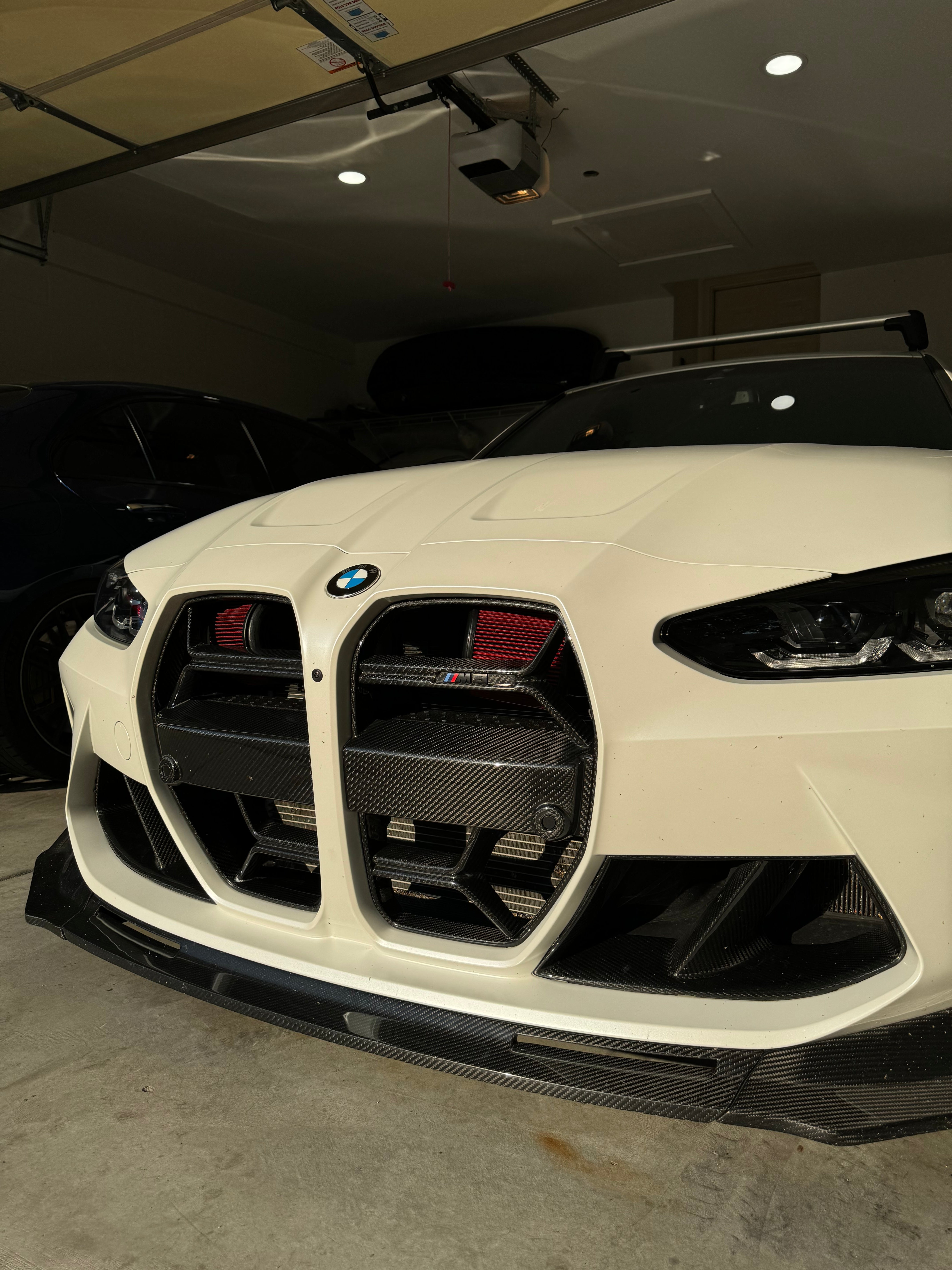White BMW M3 G80 fitted with the non-ACC CSL style dry carbon fiber grille