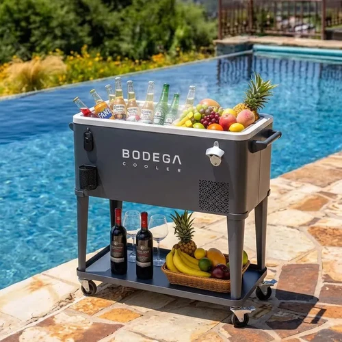 BODEGACOOLER portable beverage refrigerator cart stocked with drinks and fruit beside a swimming pool.