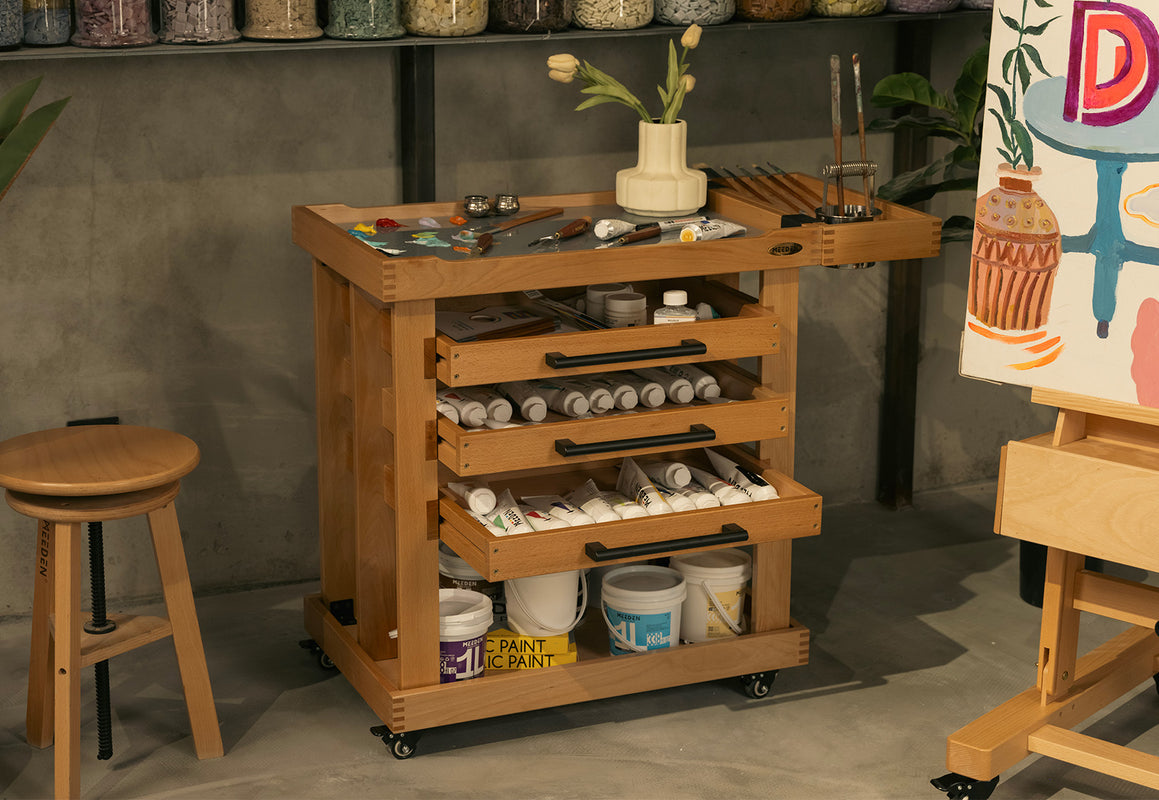 Wooden art storage cart holding painting tools and materials