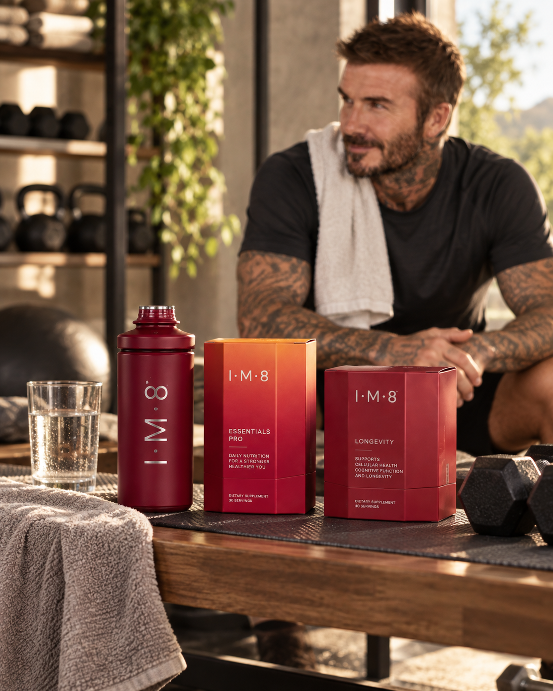 David Beckham with IM8 supplement products and signature bottle